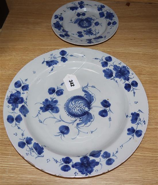 An 18th century Glasgow Delftware charger and a matching plate, largest 35.5cm